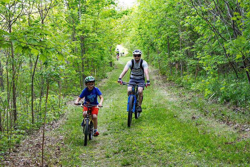 Family riding beginner return climb at Rocky Knoll MTB Trails Plymouth Wisconsin